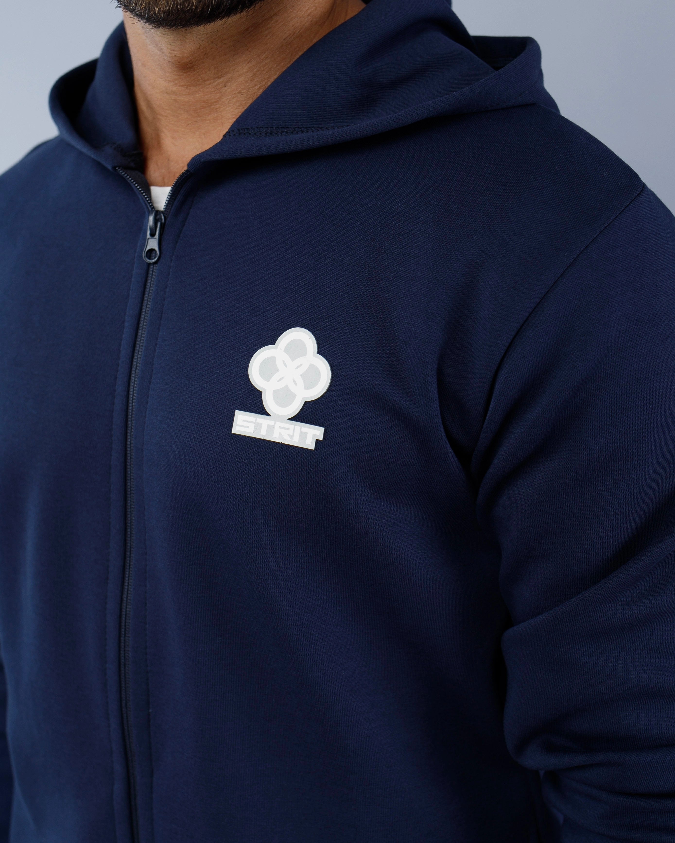 Navy blue hoodie with a white logo on a gray background